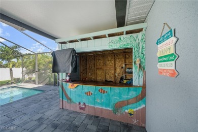 Pool Home Near Coral Oaks Golf Course featuring a great room on Burnt Store Golf Club in Florida - for sale on GolfHomes.com, golf home, golf lot