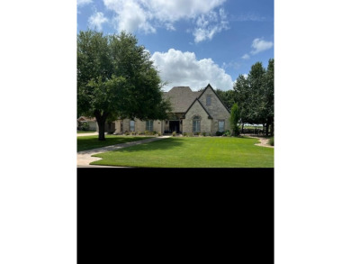 Nestled beneath an abundance of shade, located across the street on Legends Golf Course in Texas - for sale on GolfHomes.com, golf home, golf lot