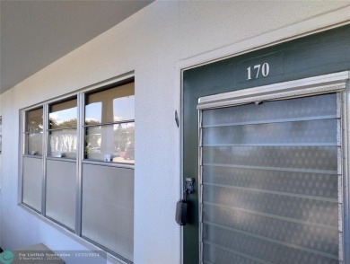 AFFORDABLE WINTER GET-AWAY!! GROUND FLOOR IN MOVE-IN CONDITION on Hillsboro Pines Golf in Florida - for sale on GolfHomes.com, golf home, golf lot