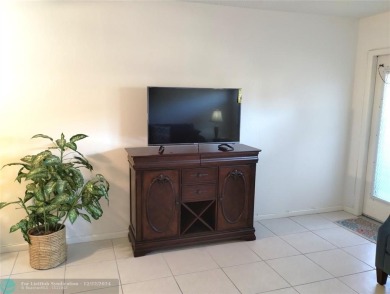 AFFORDABLE WINTER GET-AWAY!! GROUND FLOOR IN MOVE-IN CONDITION on Hillsboro Pines Golf in Florida - for sale on GolfHomes.com, golf home, golf lot