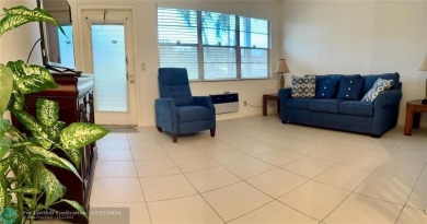 AFFORDABLE WINTER GET-AWAY!! GROUND FLOOR IN MOVE-IN CONDITION on Hillsboro Pines Golf in Florida - for sale on GolfHomes.com, golf home, golf lot