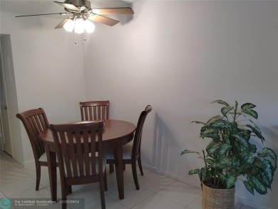 AFFORDABLE WINTER GET-AWAY!! GROUND FLOOR IN MOVE-IN CONDITION on Hillsboro Pines Golf in Florida - for sale on GolfHomes.com, golf home, golf lot