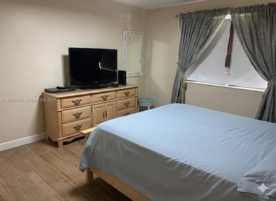 Elevated living meets total convenience in this charming on Sunrise Lakes Phase IV Golf Course in Florida - for sale on GolfHomes.com, golf home, golf lot