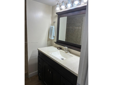 Elevated living meets total convenience in this charming on Sunrise Lakes Phase IV Golf Course in Florida - for sale on GolfHomes.com, golf home, golf lot