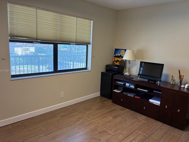 Elevated living meets total convenience in this charming on Sunrise Lakes Phase IV Golf Course in Florida - for sale on GolfHomes.com, golf home, golf lot