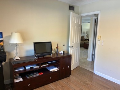 Elevated living meets total convenience in this charming on Sunrise Lakes Phase IV Golf Course in Florida - for sale on GolfHomes.com, golf home, golf lot