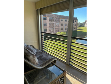 Comfort meets total convenience in this charming 2-bedroom on Sunrise Lakes Phase IV Golf Course in Florida - for sale on GolfHomes.com, golf home, golf lot