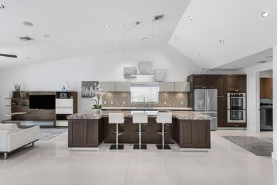 This serene house is situated on a picturesque golf course on Delaire Golf and Country Club in Florida - for sale on GolfHomes.com, golf home, golf lot