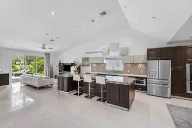 This serene house is situated on a picturesque golf course on Delaire Golf and Country Club in Florida - for sale on GolfHomes.com, golf home, golf lot