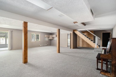 This spacious home has panoramic views of the 14th hole on on Lake Doster Golf Club in Michigan - for sale on GolfHomes.com, golf home, golf lot
