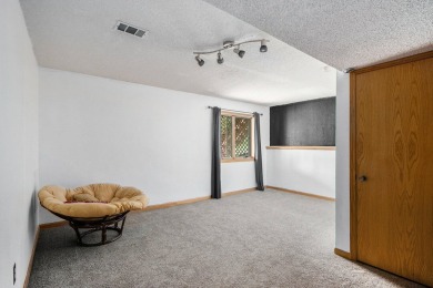 This spacious home has panoramic views of the 14th hole on on Lake Doster Golf Club in Michigan - for sale on GolfHomes.com, golf home, golf lot