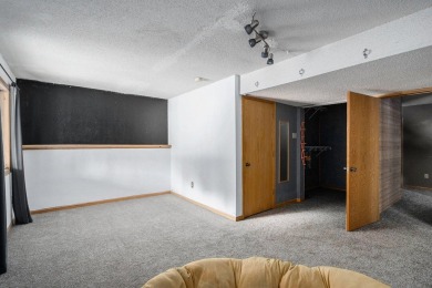 This spacious home has panoramic views of the 14th hole on on Lake Doster Golf Club in Michigan - for sale on GolfHomes.com, golf home, golf lot
