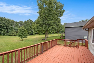 This spacious home has panoramic views of the 14th hole on on Lake Doster Golf Club in Michigan - for sale on GolfHomes.com, golf home, golf lot