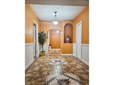 Experience refined living as this stately brick residence is on Southland Country Club in Georgia - for sale on GolfHomes.com, golf home, golf lot