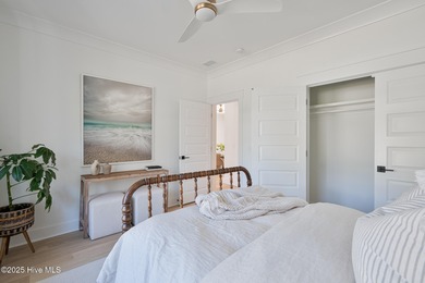 Welcome to your ideal coastal retreat! This beautiful 1.5 story on Crow Creek Golf Club in North Carolina - for sale on GolfHomes.com, golf home, golf lot