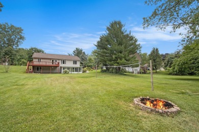 This spacious home has panoramic views of the 14th hole on on Lake Doster Golf Club in Michigan - for sale on GolfHomes.com, golf home, golf lot