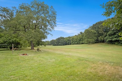 This spacious home has panoramic views of the 14th hole on on Lake Doster Golf Club in Michigan - for sale on GolfHomes.com, golf home, golf lot