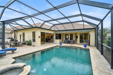 Indulge in your own private sanctuary at Pelican Pointe Golf on Pelican Pointe Golf and Country Club in Florida - for sale on GolfHomes.com, golf home, golf lot