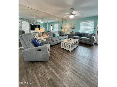 Your Coastal Oasis Awaits at 153 Gulf Highlands Blvd! STOP on Edgewater Beach Resort in Florida - for sale on GolfHomes.com, golf home, golf lot