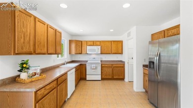 Nestled in the sought-after Woodmen Hills neighborhood, this on Antler Creek Golf Course in Colorado - for sale on GolfHomes.com, golf home, golf lot