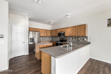 Spacious, open floor plan with kitchen and family room open to on Springfield Golf Resort in Arizona - for sale on GolfHomes.com, golf home, golf lot