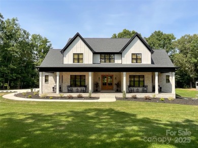Discover this stunning custom-built farmhouse nestled on 3.27 on Eagle Chase Golf Club in North Carolina - for sale on GolfHomes.com, golf home, golf lot