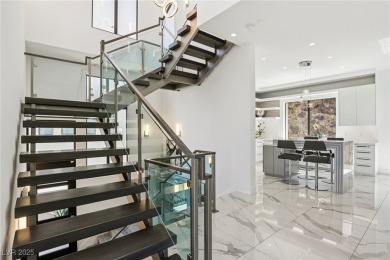 Experience sweeping Strip and mountain views from this elegant on Dragon Ridge Country Club in Nevada - for sale on GolfHomes.com, golf home, golf lot