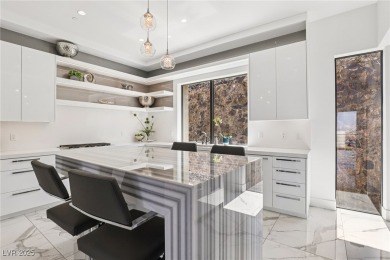 Experience sweeping Strip and mountain views from this elegant on Dragon Ridge Country Club in Nevada - for sale on GolfHomes.com, golf home, golf lot