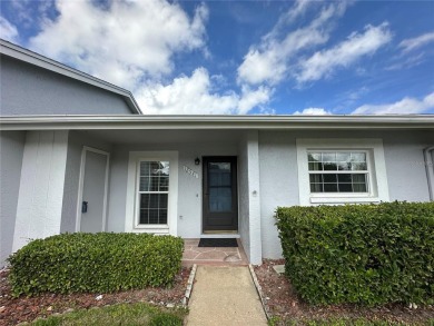 Enjoy the ease of maintenance-free living in this charming and on Beacon Woods Golf Club in Florida - for sale on GolfHomes.com, golf home, golf lot