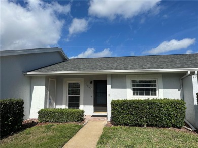 Enjoy the ease of maintenance-free living in this charming and on Beacon Woods Golf Club in Florida - for sale on GolfHomes.com, golf home, golf lot