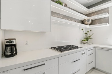Experience sweeping Strip and mountain views from this elegant on Dragon Ridge Country Club in Nevada - for sale on GolfHomes.com, golf home, golf lot