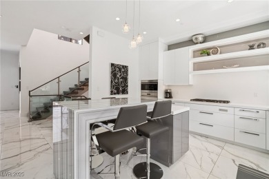Experience sweeping Strip and mountain views from this elegant on Dragon Ridge Country Club in Nevada - for sale on GolfHomes.com, golf home, golf lot