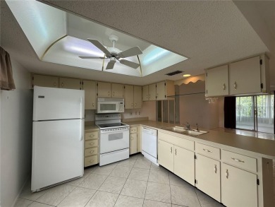 Enjoy the ease of maintenance-free living in this charming and on Beacon Woods Golf Club in Florida - for sale on GolfHomes.com, golf home, golf lot