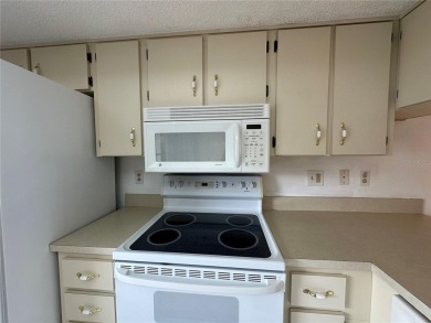 Enjoy the ease of maintenance-free living in this charming and on Beacon Woods Golf Club in Florida - for sale on GolfHomes.com, golf home, golf lot