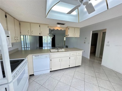 Enjoy the ease of maintenance-free living in this charming and on Beacon Woods Golf Club in Florida - for sale on GolfHomes.com, golf home, golf lot