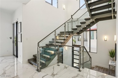 Experience sweeping Strip and mountain views from this elegant on Dragon Ridge Country Club in Nevada - for sale on GolfHomes.com, golf home, golf lot