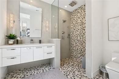 Experience sweeping Strip and mountain views from this elegant on Dragon Ridge Country Club in Nevada - for sale on GolfHomes.com, golf home, golf lot