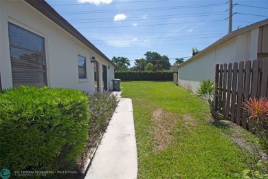 Spacious Gated two bedrooms, two bath single family home with a on Cypress Creek Country Club - Boynton Beach in Florida - for sale on GolfHomes.com, golf home, golf lot