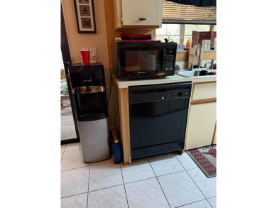 THIS LOVELY, MANUFACTURED HOME ON LEASED LAND.  PRICED TO SELL on Pine Lakes Country Club in Florida - for sale on GolfHomes.com, golf home, golf lot