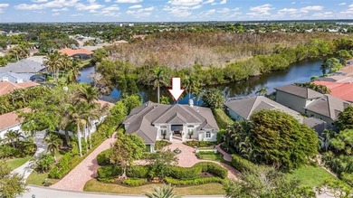 This extraordinary residence offers stunning lake and on Bentley Village Golf Course in Florida - for sale on GolfHomes.com, golf home, golf lot