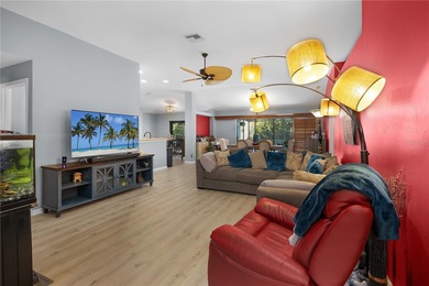 Welcome to this beautifully maintained waterfront home in on Palmetto-Pine Country Club in Florida - for sale on GolfHomes.com, golf home, golf lot