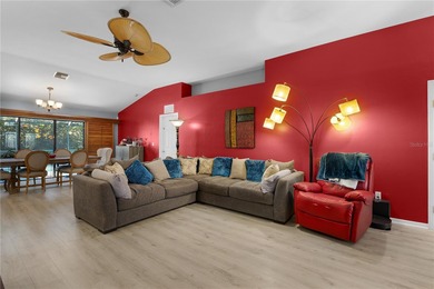 Welcome to this beautifully maintained waterfront home in on Palmetto-Pine Country Club in Florida - for sale on GolfHomes.com, golf home, golf lot