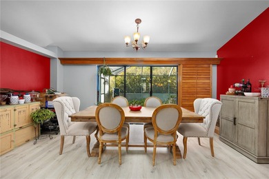 Welcome to this beautifully maintained waterfront home in on Palmetto-Pine Country Club in Florida - for sale on GolfHomes.com, golf home, golf lot