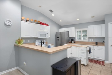 Welcome to this beautifully maintained waterfront home in on Palmetto-Pine Country Club in Florida - for sale on GolfHomes.com, golf home, golf lot