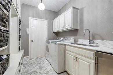 This is more than an upgraded home--it's a masterpiece of modern on The Trails of Frisco Golf Club in Texas - for sale on GolfHomes.com, golf home, golf lot