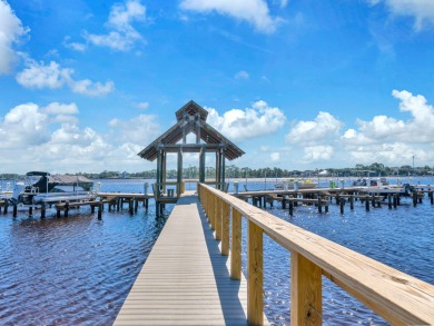 Welcome Home to your exquisite lakefront coastal oasis!  Wild on Sharks Tooth Golf Club in Florida - for sale on GolfHomes.com, golf home, golf lot