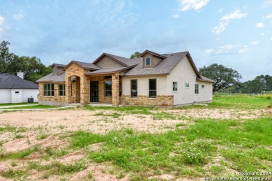 Magnificent custom home with oversized lot on the golf course in on Devine Golf Course in Texas - for sale on GolfHomes.com, golf home, golf lot