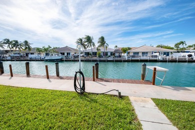 This waterfront half duplex is now available to purchase, or on Key Colony Beach Golf Course in Florida - for sale on GolfHomes.com, golf home, golf lot