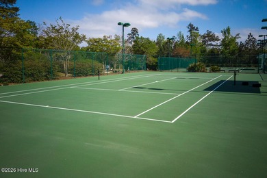 Enjoy easy, single-level, maintenance-free living in this on Cape Fear National At Brunswick Forest in North Carolina - for sale on GolfHomes.com, golf home, golf lot