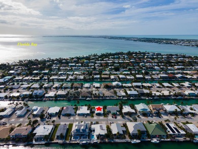 This waterfront half duplex is now available to purchase, or on Key Colony Beach Golf Course in Florida - for sale on GolfHomes.com, golf home, golf lot